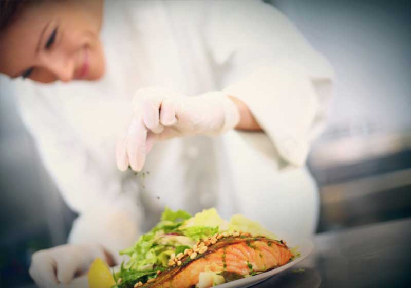 chef cooking salmon